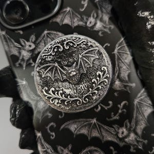 Ornate bat in full moon, phone holder hand painted 3d relief stand and grip decor, 1.57” round black and silver pewter look, iPhone, Samsung