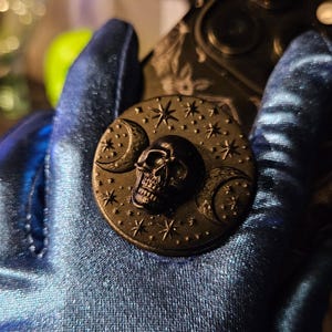 Skull and Triple Crescent Full Moon, phone holder 3d relief stand grip decor, 1.57” round black three dimensional texture, iPhone, Samsung