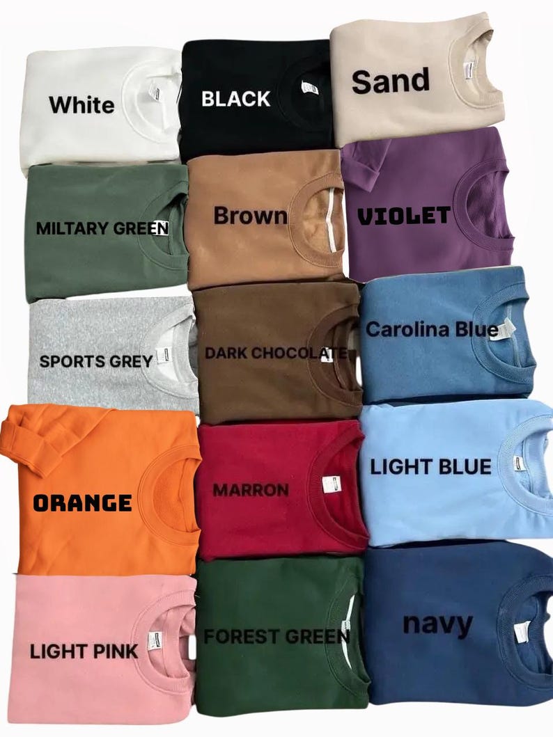 May include: A collection of crewneck sweatshirts in various colors, including white, black, sand, military green, brown, violet, sports grey, dark chocolate, Carolina blue, orange, maroon, light blue, light pink, forest green, and navy. Each sweatshirt has the color name printed on it.