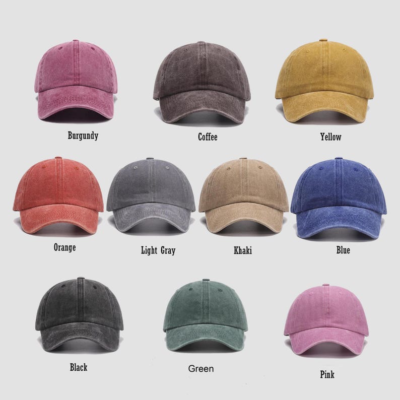 May include: A collection of nine baseball caps in various colors, including burgundy, coffee, yellow, orange, light gray, khaki, blue, black, green, and pink. Each cap has a curved brim and a classic, unstructured design. The colors are labeled below each cap.