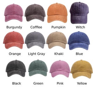 May include: A collection of twelve baseball caps in various colors, including burgundy, coffee, pumpkin, witch, orange, light gray, khaki, blue, black, green, pink, and yellow. Each cap has a curved brim and a fabric strap.