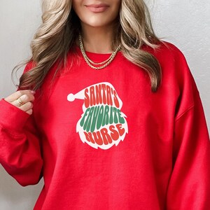 Santa’s favorite nurse sweatshirt, gift for nurse, Christmas sweatshirt for nurse, Santa nurse shirt