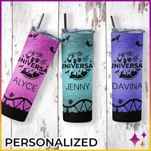 May include: Three personalized stainless steel tumblers with glitter finishes. The tumblers feature a black and white graphic of a roller coaster and the Universal Studios logo. Each tumbler has a different name: Alyce, Jenny, and Davina.