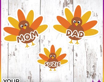 May include: Three Thanksgiving turkey cutouts with the words "Mom", "Dad", and "Suzie" on them. The turkeys are brown with orange and yellow feathers.