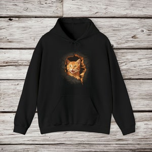 Orange Cat Tearing though wall Unisex Heavy Blend™ Hooded Sweatshirt
