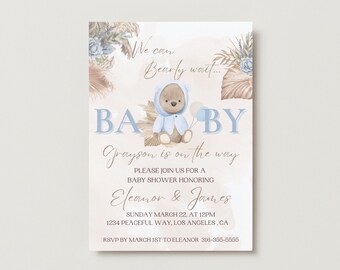 May include: A baby shower invitation with a blue and brown color scheme. The invitation features a cartoon bear wearing a blue hooded sweater and holding a balloon. The text on the invitation reads "We can Bearly wait... Baby Grayson is on the way. Please join us for a baby shower honoring Eleanor & James. Sunday March 22, at 12pm. 1234 Peaceful Way, Los Angeles, CA. RSVP by March 1st to Eleanor 316-355-5555."