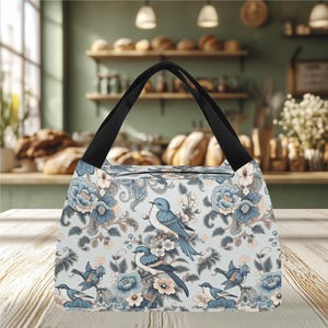 Bolsa de almuerzo portátil. Divertida y original bolsa térmica con diseño de pájaro azul. Ideal para la playa o un picnic. Un regalo ideal.