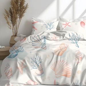 May include: White bedding set with a seashell and starfish pattern in shades of peach, blue, and coral. The set includes a duvet cover and pillowcases. The design features various seashells, starfish, and coral branches.