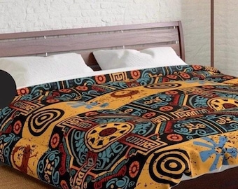 May include: A bed with a brown wooden headboard and two white pillows. The bed is covered with a colorful comforter featuring a repeating pattern of geometric shapes in yellow, black, red, and blue.