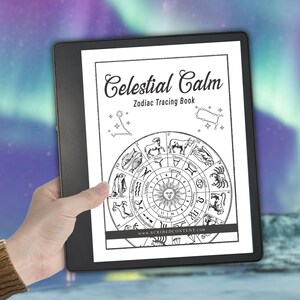 May include: A black digital tablet displaying a white page titled Celestial Calm Zodiac Tracing Book. The page features a central circular zodiac wheel with twelve astrological signs, a sun illustration, and constellations at the top corners.