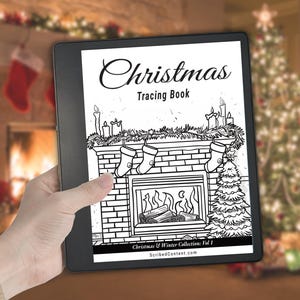 May include: A digital e-reader displaying a black and white line art cover titled Christmas Tracing Book. The illustration features a brick fireplace with stockings, candles, and a Christmas tree. The bottom text reads Christmas & Winter Collection: Vol 1 and ScribedContent.com.