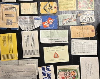 May include: A collection of vintage ephemera, including envelopes, postcards, receipts, and a menstrual record chart. The items are arranged on a black surface and feature a variety of colors, fonts, and designs.