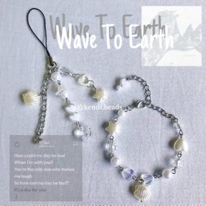 May include: A white and silver charm bracelet featuring a seashell, stars, and hearts. The bracelet has a phone charm attachment. The text "Wave To Earth" is written above the bracelet. The text "@kendi.beads" is written below the bracelet. The text "How could my day be bad When I'm with you? You're the only one who makes me laugh So how can my day be bad? It's a day for you" is written on a white background.