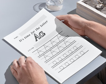 May include: A black and white worksheet with the text "It's time for the letter Aa" and a dotted line for tracing the letter A. The worksheet has a section for the student's name and a section for what the letter A is for.
