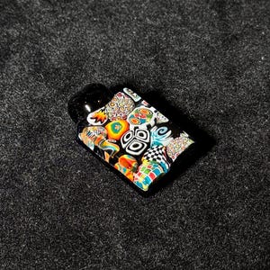 Mini chaos tablet blown glass murrine pendant with jetblack bale and cobalt backing
