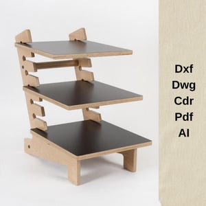 May include: A three-tiered wooden desk organizer with black shelves and a natural wood frame. The organizer has a unique design with adjustable shelf heights. The text on the side reads: Dxf, Dwg, Cdr, Pdf, Al.