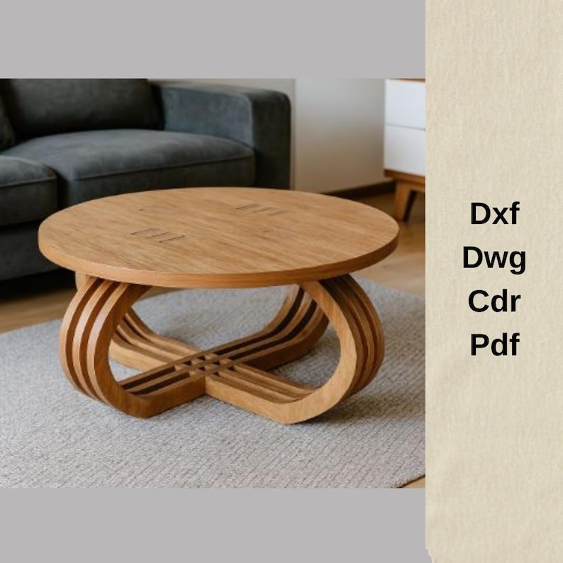 May include: A round, light brown wooden coffee table with a unique base design. The base features curved, layered supports that intersect at the center. The table is approximately 36 inches in diameter. The text "Dxf, Dwg, Cdr, Pdf" is visible.