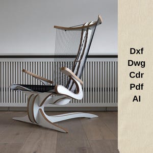 May include: A contemporary chair in white and wood, showcasing a distinctive design. It has a woven black back and seat, curved armrests, and a unique base. The frame is white with wood detailing. The image also includes the text: Dxf, Dwg, Cdr, Pdf, Al.
