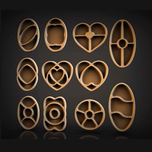 May include: Set of 10 decorative wooden trays in various shapes, including oval, heart, and round. The trays are made of light brown wood and have intricate designs.