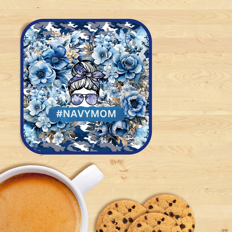 May include: A blue and white camouflage coaster with a floral design and a woman's face with sunglasses. The text #NAVYMOM is printed on the coaster.
