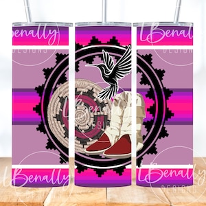 May include: A tall, insulated tumbler with a vibrant design. The design features a black hummingbird, a woven basket, and a pair of red-soled boots, set against a purple and pink striped background. The text "Benally Designs" is also visible.
