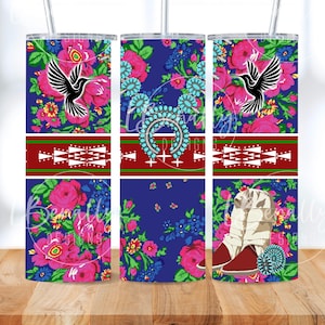 May include: A set of three stainless steel tumblers with floral and geometric designs. The tumblers feature a vibrant blue background with pink roses, blue flowers, and a black bird. Each tumbler has a different design, including a geometric pattern and text.