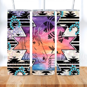 May include: A set of three stainless steel tumblers with a horse design. The tumblers feature a colorful sunset background, turquoise accents, and black and white geometric patterns. The text "LB Designs" is visible.