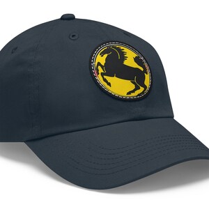 May include: A navy blue baseball cap with a yellow and black horse logo patch.