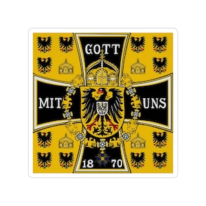 May include: A black and yellow flag with a black cross and a German eagle in the center. The flag has the text "Gott mit uns" and "1870" on it.