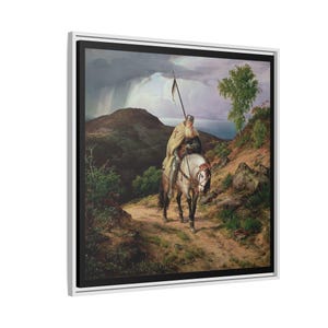 May include: A framed canvas print of an oil painting depicting a knight on horseback. The knight, with a long white beard, rides a white horse along a path. The background features a landscape with mountains, a body of water, and a stormy sky.