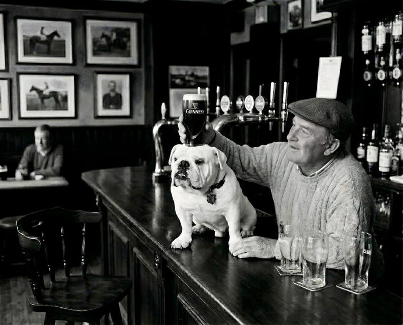 Vintage-style black and white photo of an English Bulldog balanced perfectly on an antique wooden pub bar counter. The dog holds a pint glass of dark stout on its flat head. A man in a flat cap stands beside the bulldog, looking on with pride. A traditional bar with beer taps and equestrian-themed photos is visible in the background.