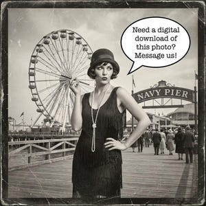 May include: Vintage sepia-toned photo of a woman in a flapper dress, hat, and pearl necklace, holding a cigarette holder. The background features a Ferris wheel, a pier, and the text "Navy Pier". A speech bubble says "Need a digital download of this photo? Message us!"