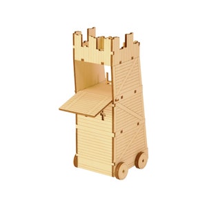 May include: A wooden siege tower model with a ramp, battlements, and two wheels. Constructed from light-coloured wood, the tower has visible grain and cross-bracing. The ramp is open, showing the interior. The model is approximately 20 cm tall.