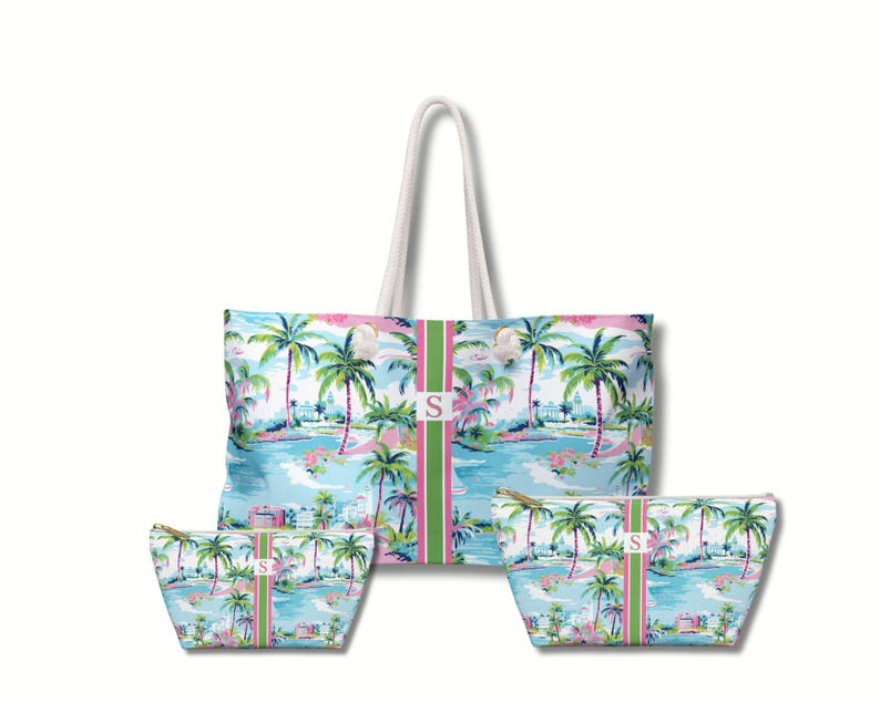 May include: A large tote bag and two smaller zippered pouches featuring a tropical palm tree print in shades of blue, green, and pink. Each item has a vertical green and pink striped center panel with a white square containing the letter S.