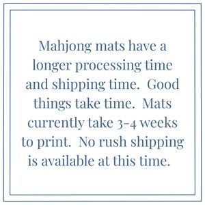 May include: Text on a white background with a blue border. The text reads: "Mahjong mats have a longer processing time and shipping time. Good things take time. Mats currently take 3-4 weeks to print. No rush shipping is available at this time."
