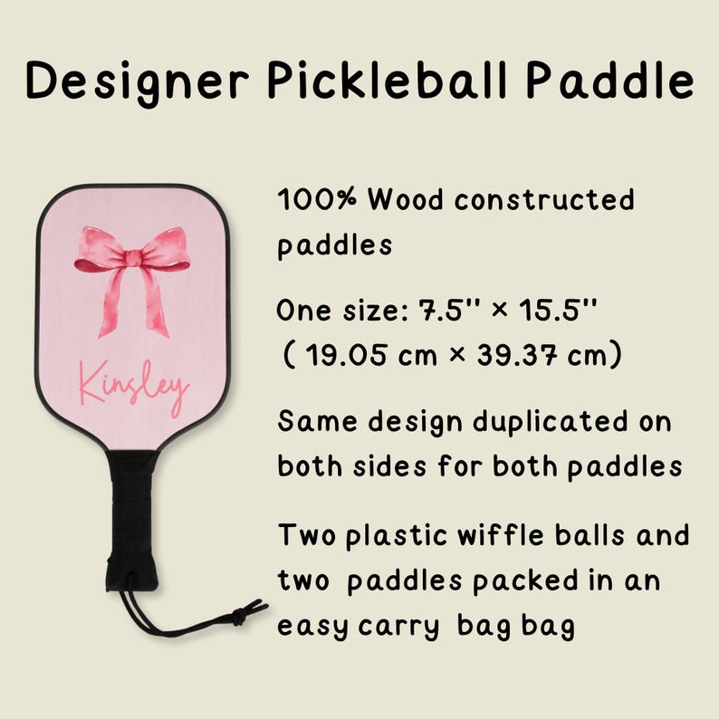 May include: A pink pickleball paddle with a pink bow and the name "Kinsley" written on it. The paddle is made of 100% wood and measures 7.5 inches by 15.5 inches (19.05 cm x 39.37 cm). It comes with two plastic wiffle balls and an easy carry bag.