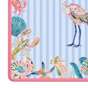 May include: A light blue and white striped fabric featuring a vibrant coastal pattern. The design includes a pink flamingo, a lobster, a crab, a seahorse, a seashell, and a starfish, all decorated with intricate floral motifs and a pink border.