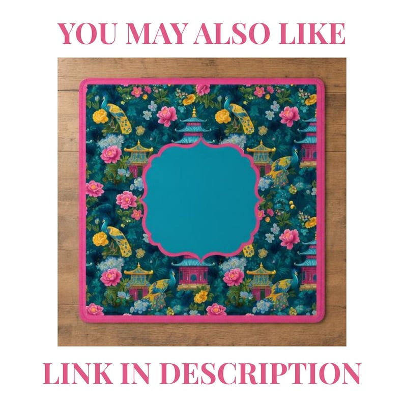 May include: A square mat with a dark teal background featuring a repeating pattern of yellow peacocks, pink peonies, and blue pagodas. The mat has a bright pink border and a large, solid teal scalloped frame in the center for text placement.