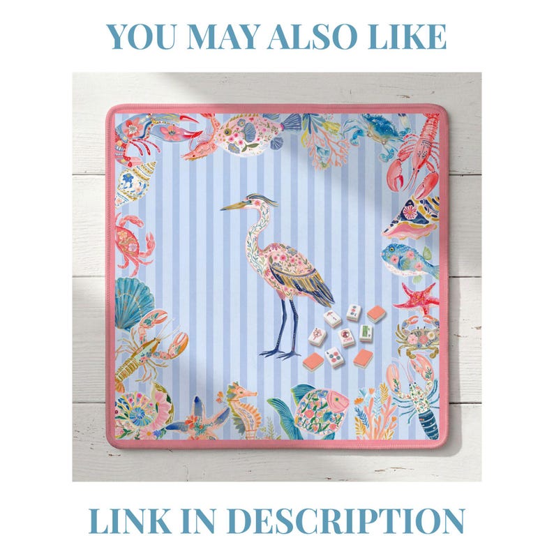 May include: A square mahjong mat with a light blue and white striped background, featuring a central heron illustration surrounded by colorful sea life including crabs, lobsters, fish, and shells, all bordered by a solid pink trim.
