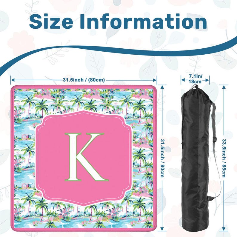 May include: A beach mat with a tropical palm tree design, measuring 31.5 inches (80cm) square, with a pink central panel featuring the letter "K". Includes a black carrying bag, 33.5 inches (85cm) long.