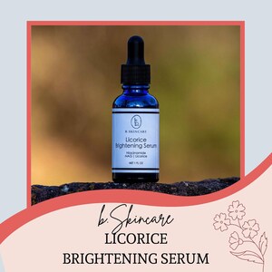 May include: A blue glass bottle of B.SKINCARE Licorice Brightening Serum with a black dropper. The label reads "Licorice Brightening Serum" and "NET 1 FL OZ". The product is displayed on a dark surface with a blurred background.