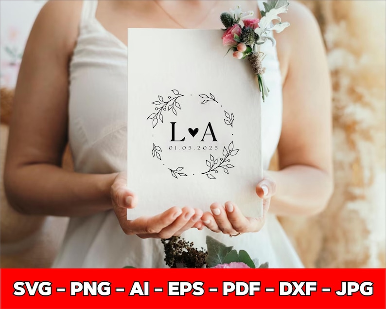 May include: A cream-colored wedding invitation featuring a black floral wreath design with the initials "L&hearts;A" and the date "01.05.2025". The invitation is held by a person wearing a white dress. The bottom of the image has the text "SVG - PNG - AI - EPS - PDF - DXF - JPG".