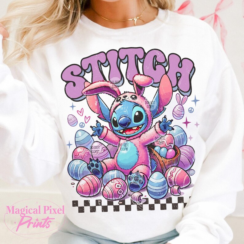 May include: White sweatshirt with a pink and blue cartoon Stitch wearing a bunny costume and surrounded by pastel Easter eggs. The text "STITCH" is in a purple retro font.