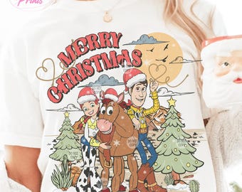 May include: A white t-shirt with a vintage-style Christmas design featuring Woody, Jessie, and Bullseye from Toy Story. The text "Merry Christmas" is written in a gold script font.