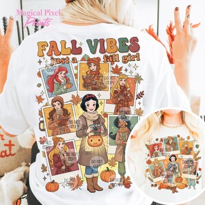 May include: White t-shirt with the text "FALL VIBES just a fall girl" in fall colors. The shirt features illustrations of Disney princesses in autumn attire, surrounded by fall leaves and pumpkins. A small circular image of the design is at the bottom.