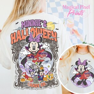 May include: White t-shirt with a vintage-style graphic of Minnie Mouse dressed as a vampire. The graphic says "Minnie's Halloween" and "Trick or Treat". There are other Disney characters in the graphic, including Mickey Mouse, Donald Duck, and Goofy. The text "Do Not Copy" appears multiple times on the graphic.