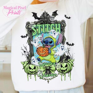 May include: White long-sleeve shirt featuring a Halloween-themed graphic. The design includes Stitch holding a pumpkin, surrounded by ghosts, bats, and the words "Spooky Season" and "Stitch".