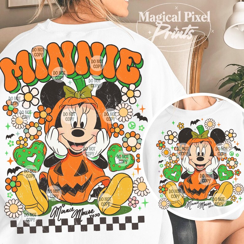 May include: White t-shirt featuring a Halloween-themed Minnie Mouse design. The design includes Minnie Mouse dressed as a pumpkin, surrounded by flowers, hearts, and the word "MINNIE" in orange and green. The text "DO NOT COPY" is repeated throughout the design.