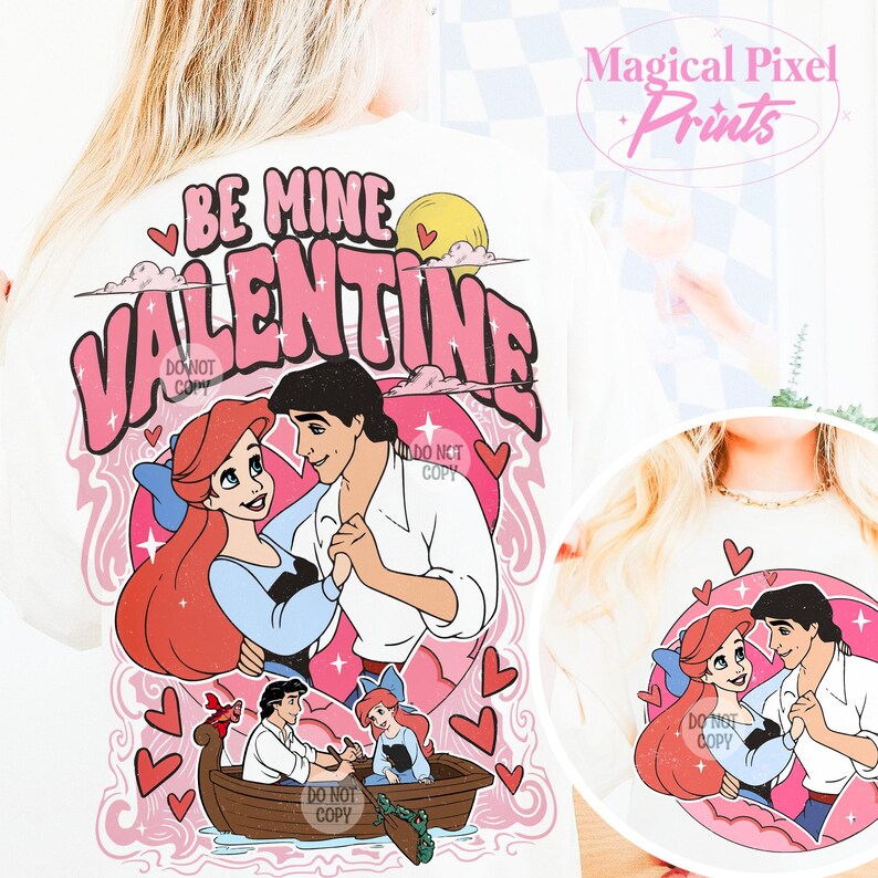 May include: White t-shirt with a pink and white graphic design featuring Ariel and Prince Eric from The Little Mermaid. The graphic says "Be Mine Valentine" in pink letters.