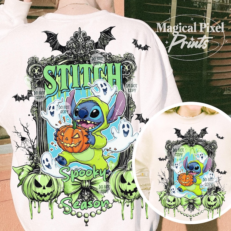 May include: White sweatshirt featuring a Halloween-themed graphic. The design includes the word "STITCH" in green, a cartoon character holding a pumpkin, ghosts, and the words "Spooky Season". Bats and green pumpkins complete the design.